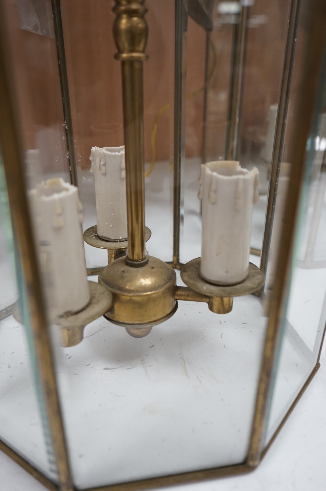 A pair of French octagonal glass and brass lanterns, 40cm